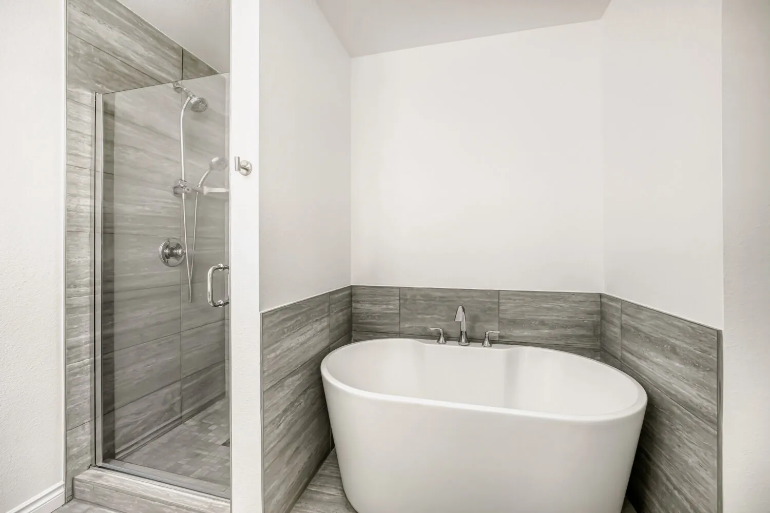 Primary bathroom, tub and shower view