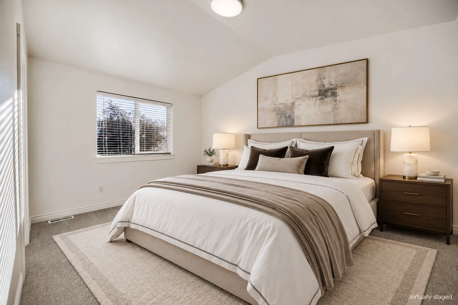 Vaulted primary bedroom, virtually staged