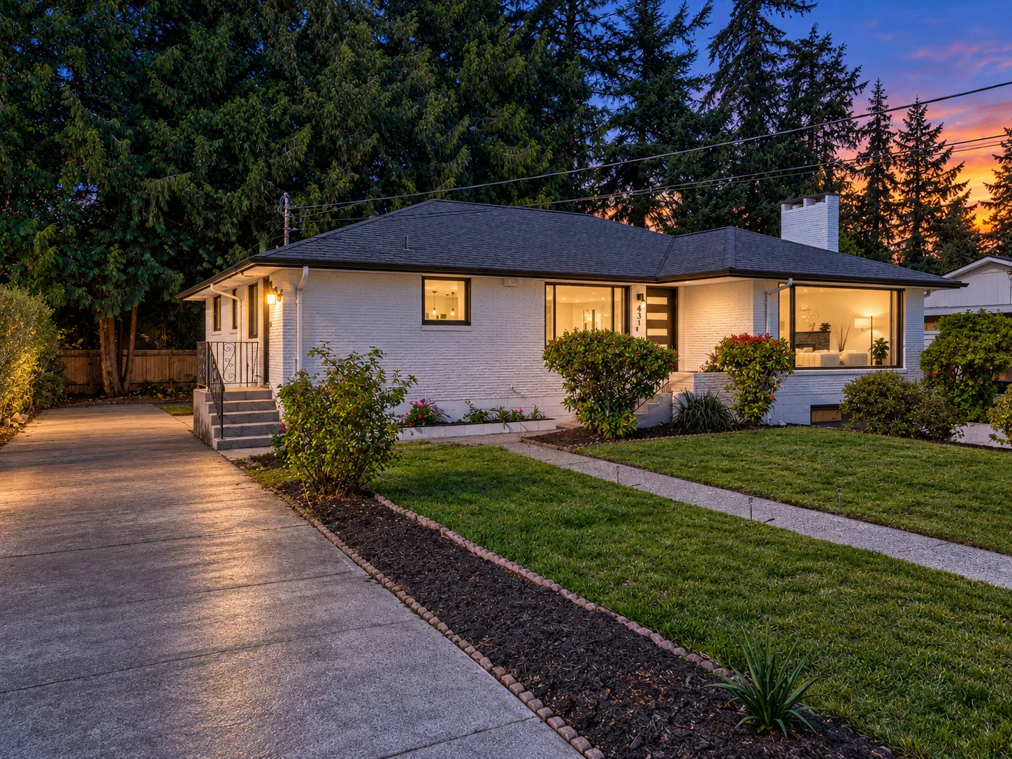Front of the home at dusk from the driveway